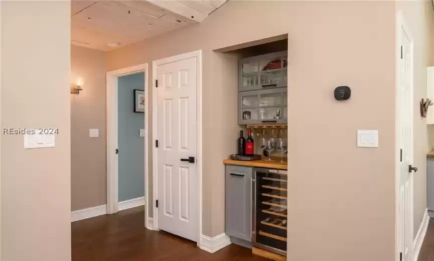 Bar area featuring wine cooler & storage