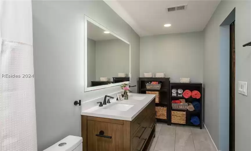 Upgraded primary ensuite with tile shower & backlit mirror